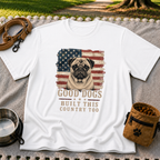 White T-shirt mockup featuring pug portrait against a distressed American flag with patriotic lettering.