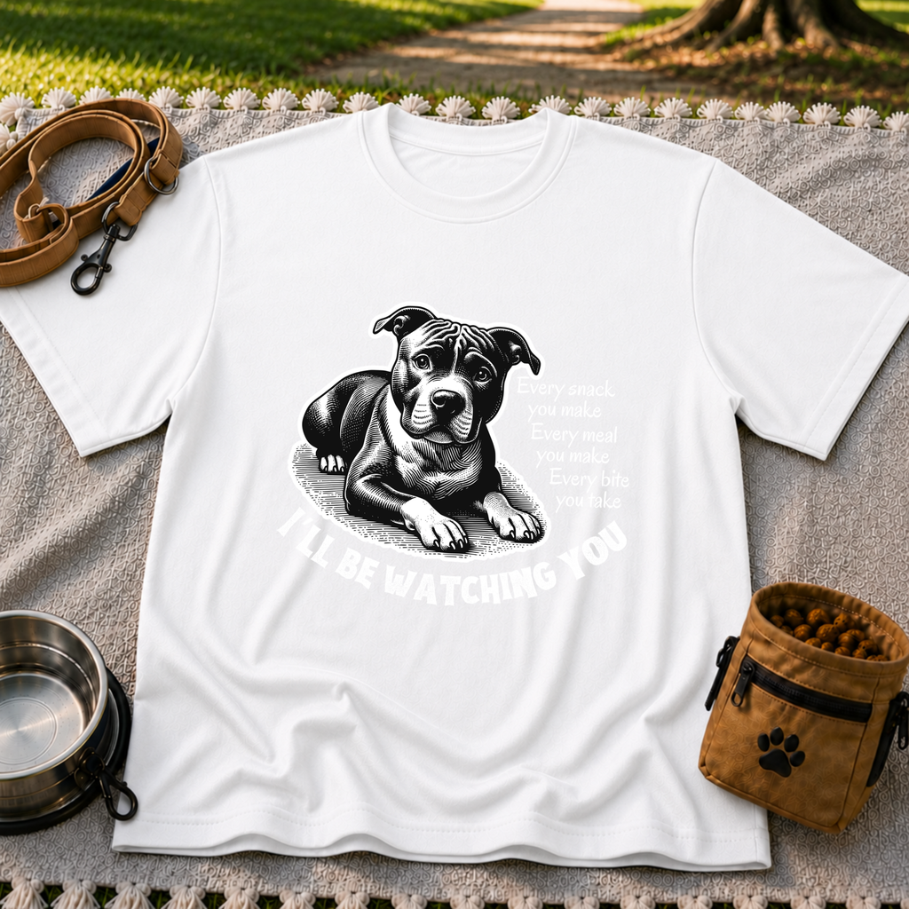 a watchful dog paired with a line about keeping an eye on you. On a White T-shirt.
