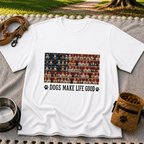 White T-shirt mockup featuring rows of dog portraits over an American flag with Dogs Make Life Good lettering.