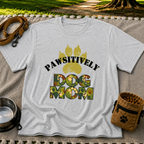 “Pawsitively Dog Mom” lettering in a camouflage treatment. On a Sport Grey T-shirt.