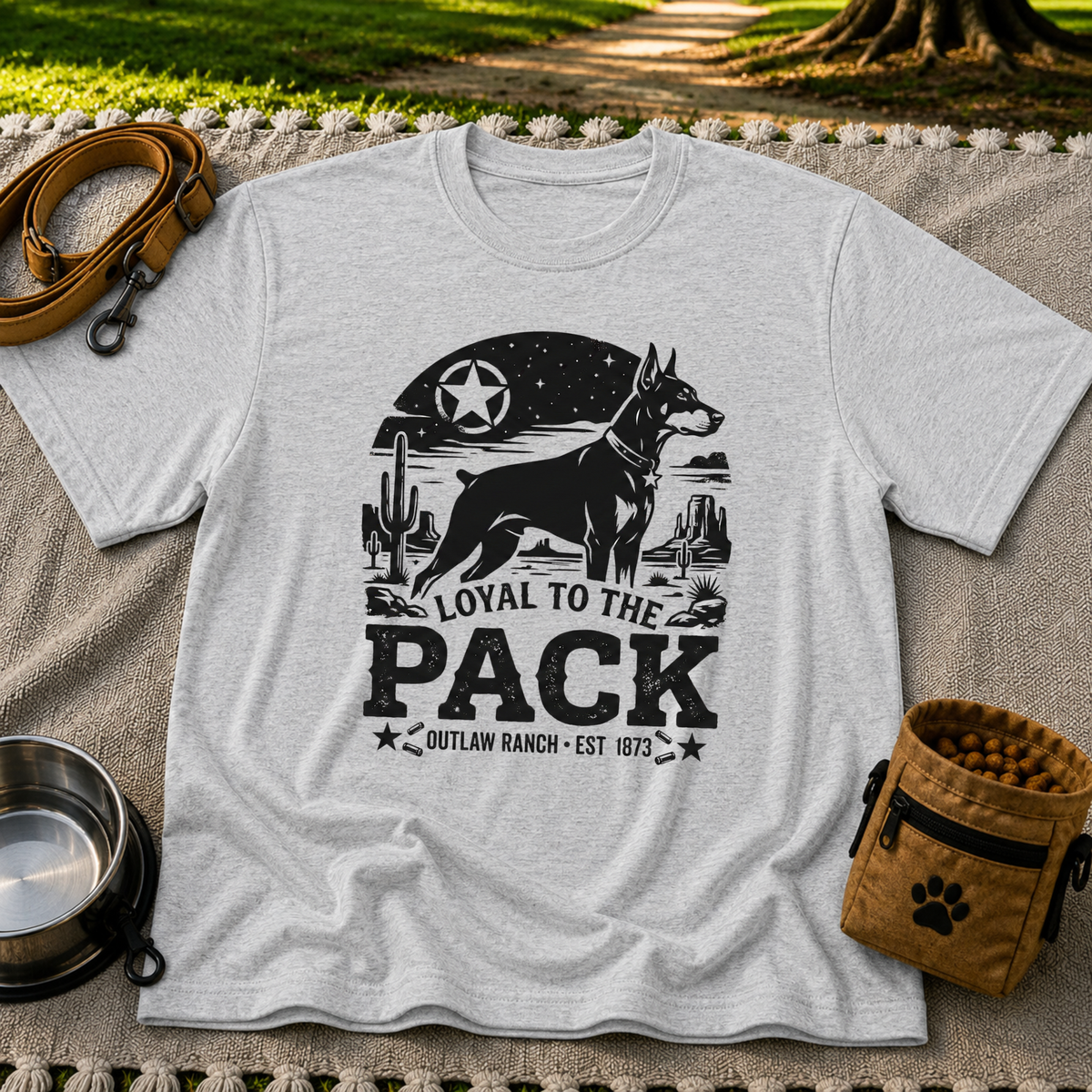 a ranch dog inside a “Loyal to the Pack” western badge. On a Sport Grey T-shirt.