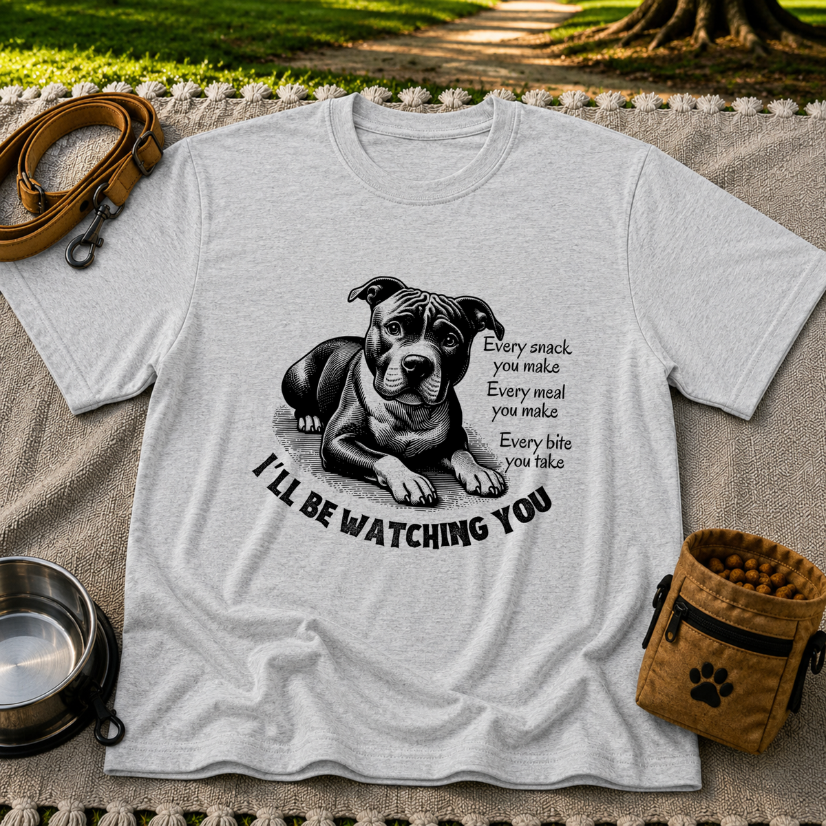 a watchful dog paired with a line about keeping an eye on you. On a Sport Grey T-shirt.