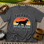 Dark Heather Grey T-shirt mockup featuring dog silhouette walking across a striped sunset beneath Therapy Is a Long Walk.