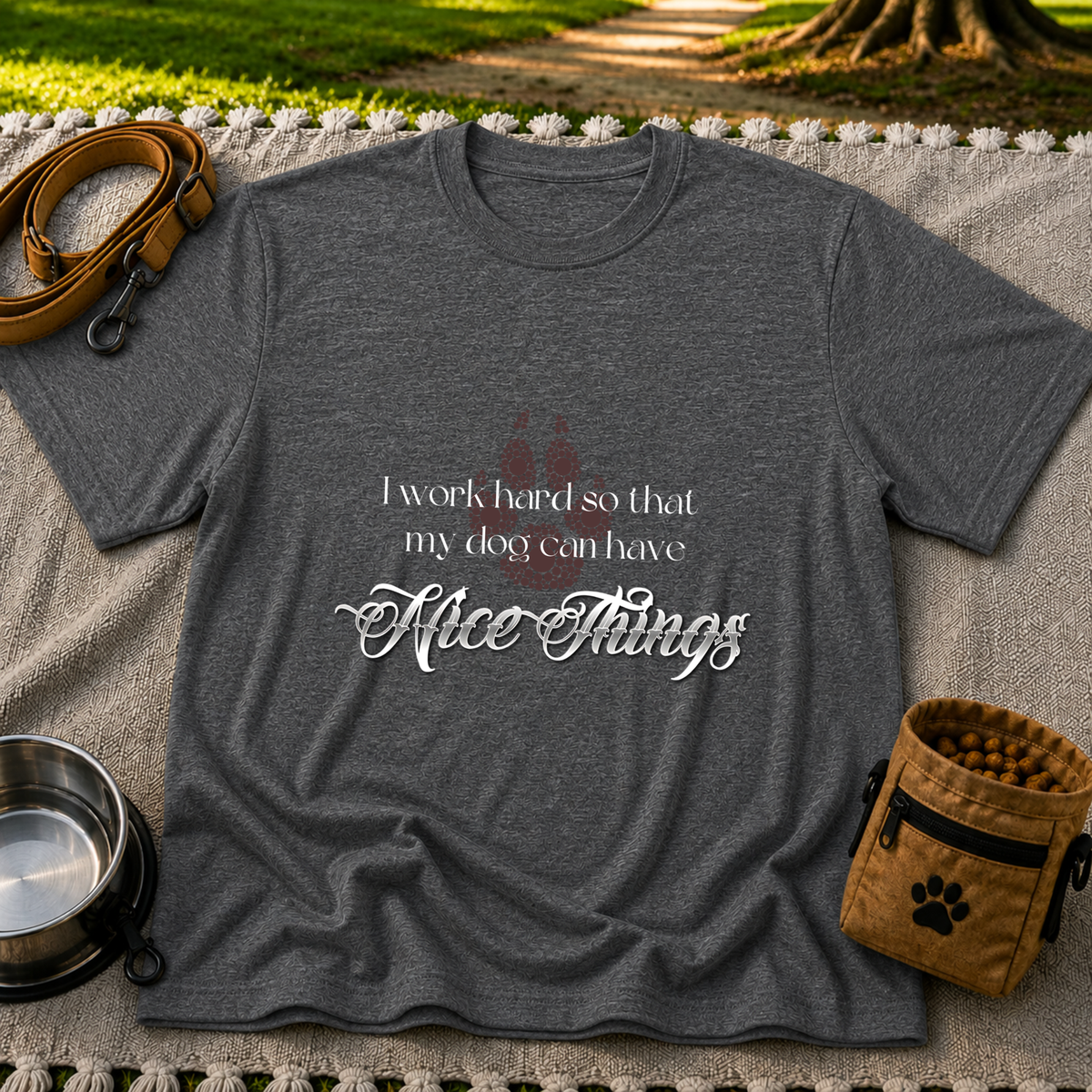 a paw and a “work hard so my dog can have nice things” message. On a Dark Heather Grey T-shirt.