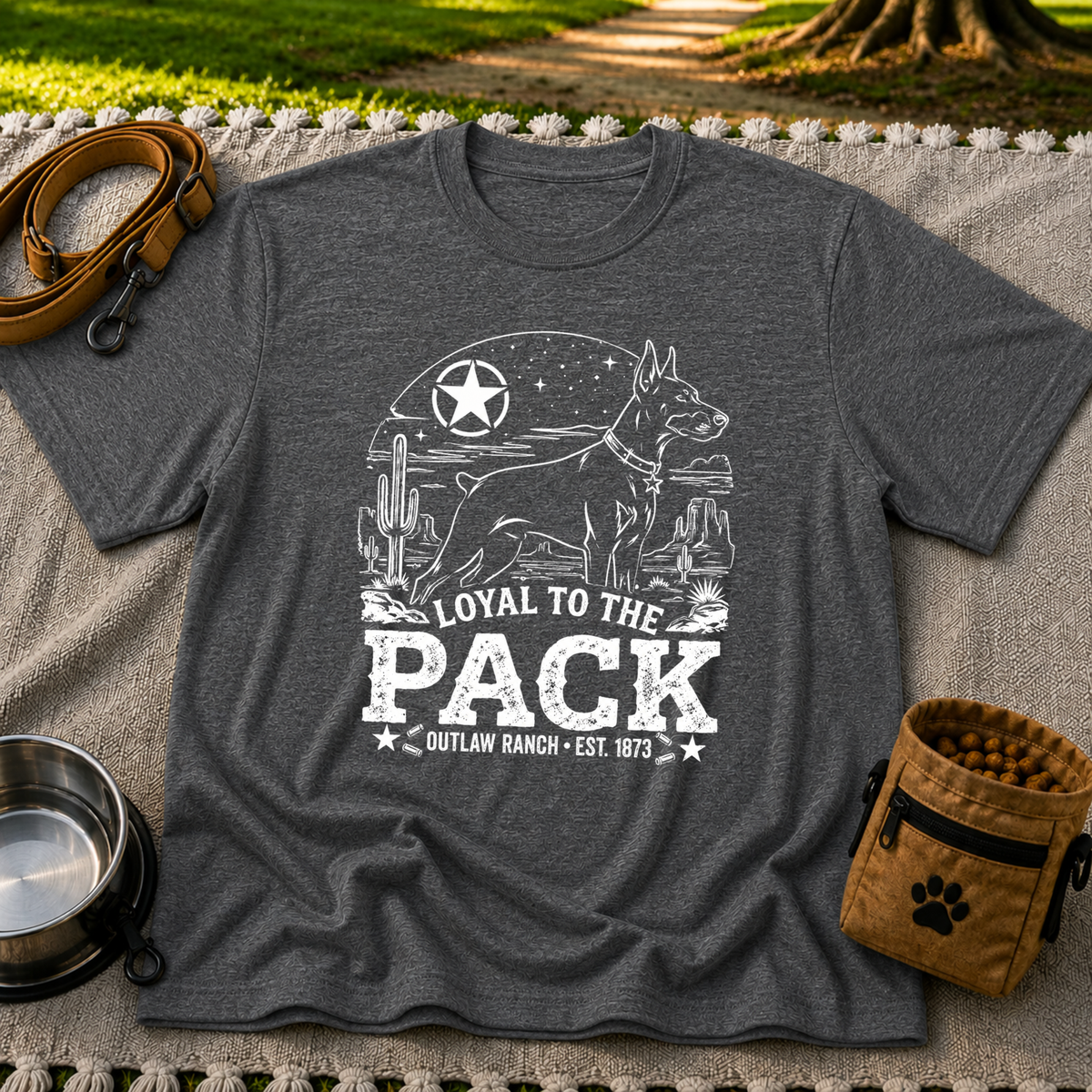 a ranch dog inside a “Loyal to the Pack” western badge. On a Dark Heather Grey T-shirt.