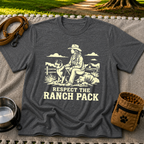 Dark Heather Grey T-shirt mockup featuring western ranch scene with a rider, dog, open landscape, and Respect the Ranch Pack lettering.