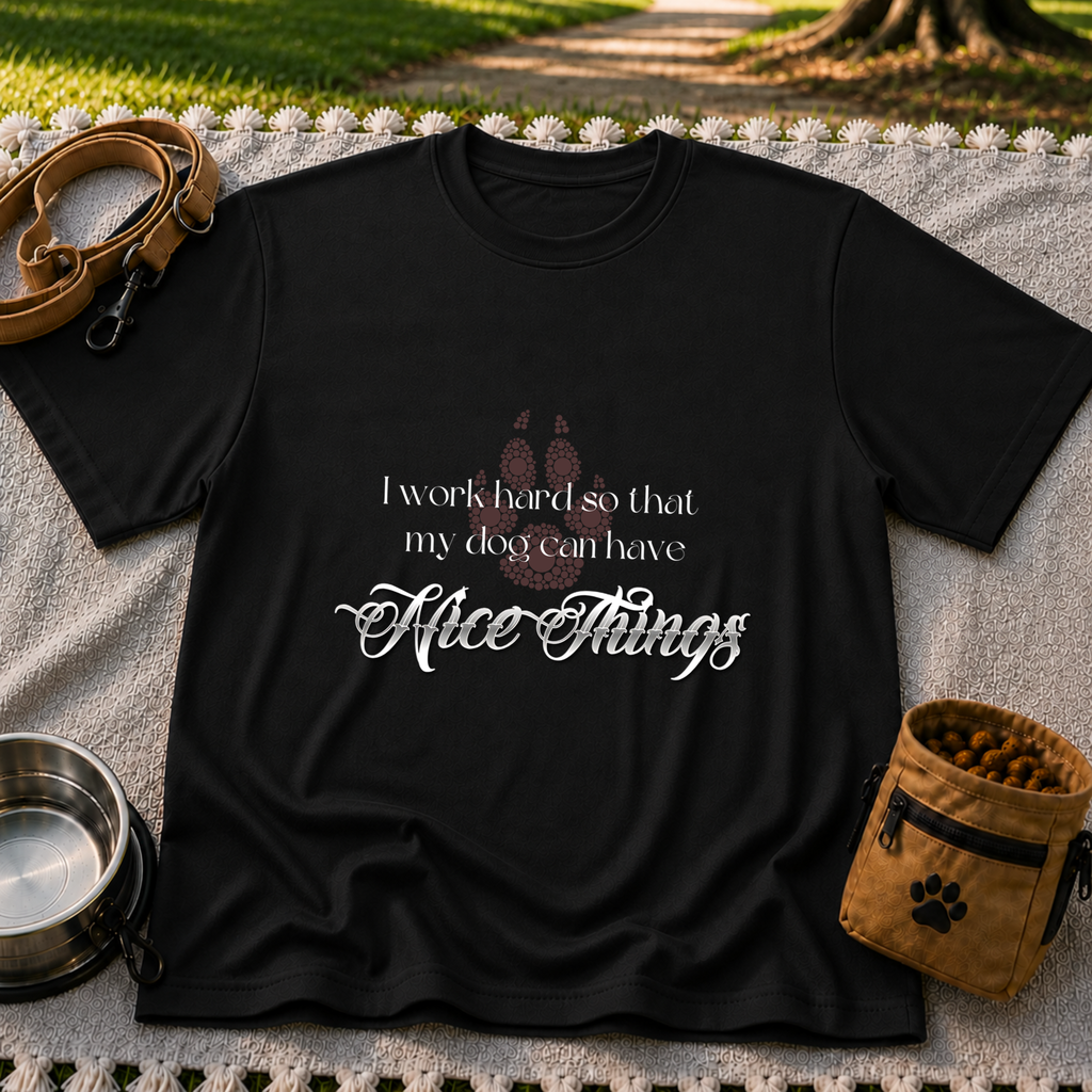 a paw and a “work hard so my dog can have nice things” message. On a Black T-shirt.