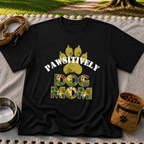 “Pawsitively Dog Mom” lettering in a camouflage treatment. On a Black T-shirt.