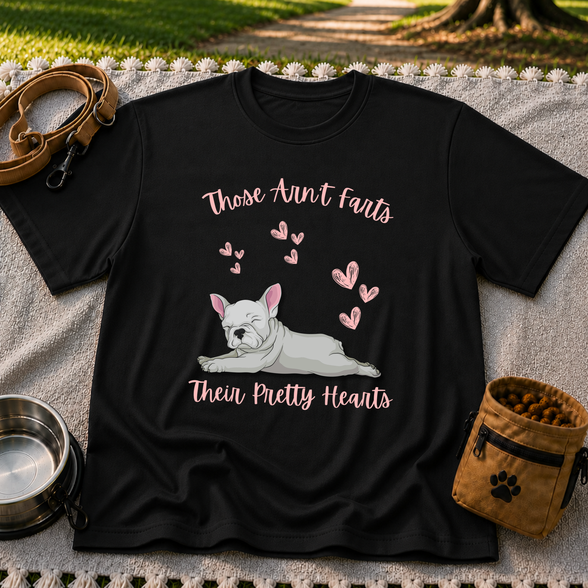 Black T-shirt mockup featuring reclining French Bulldog surrounded by pink hearts and the Pretty Hearts joke.