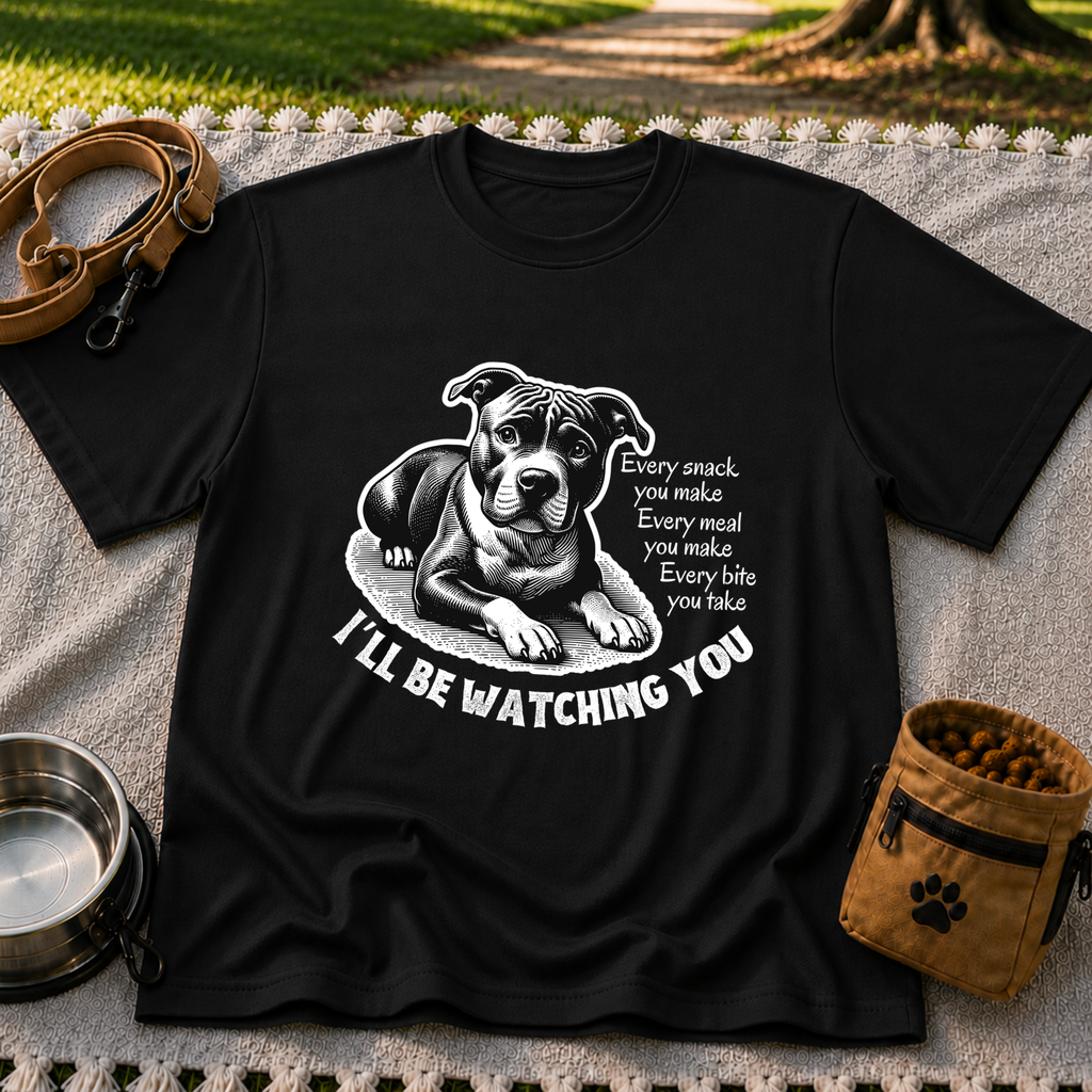 a watchful dog paired with a line about keeping an eye on you. On a Black T-shirt.