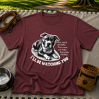a watchful dog paired with a line about keeping an eye on you. On a Maroon T-shirt.