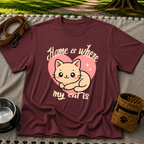 Maroon T-shirt mockup featuring kawaii cat resting inside a pink heart with Home Is Where My Cat Is lettering.