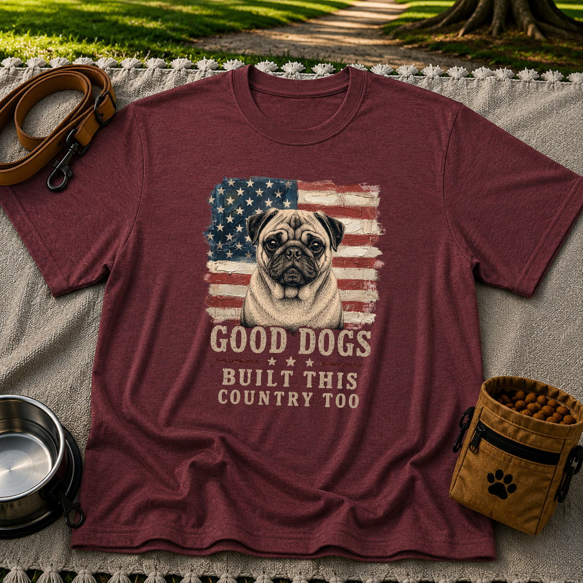 Maroon T-shirt mockup featuring pug portrait against a distressed American flag with patriotic lettering.