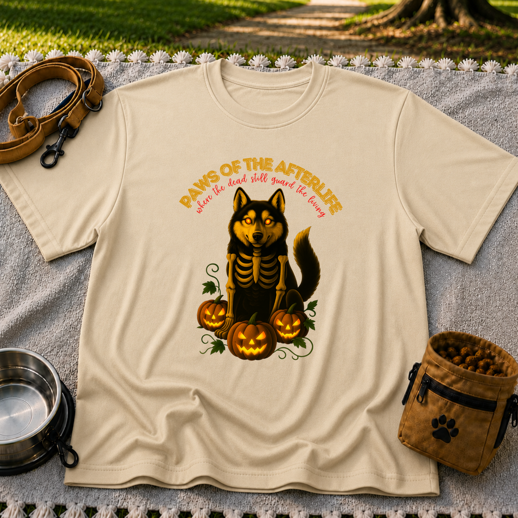 Paws of the Afterlife Husky Skeleton Halloween design on a Sand T-shirt.