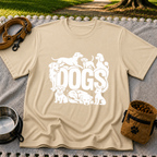 the word “Dogs” surrounded by several dog portraits. On a Sand T-shirt.