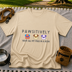 a row of three pugs beneath “Pawsitively all my pugs in a row”. On a Sand T-shirt.