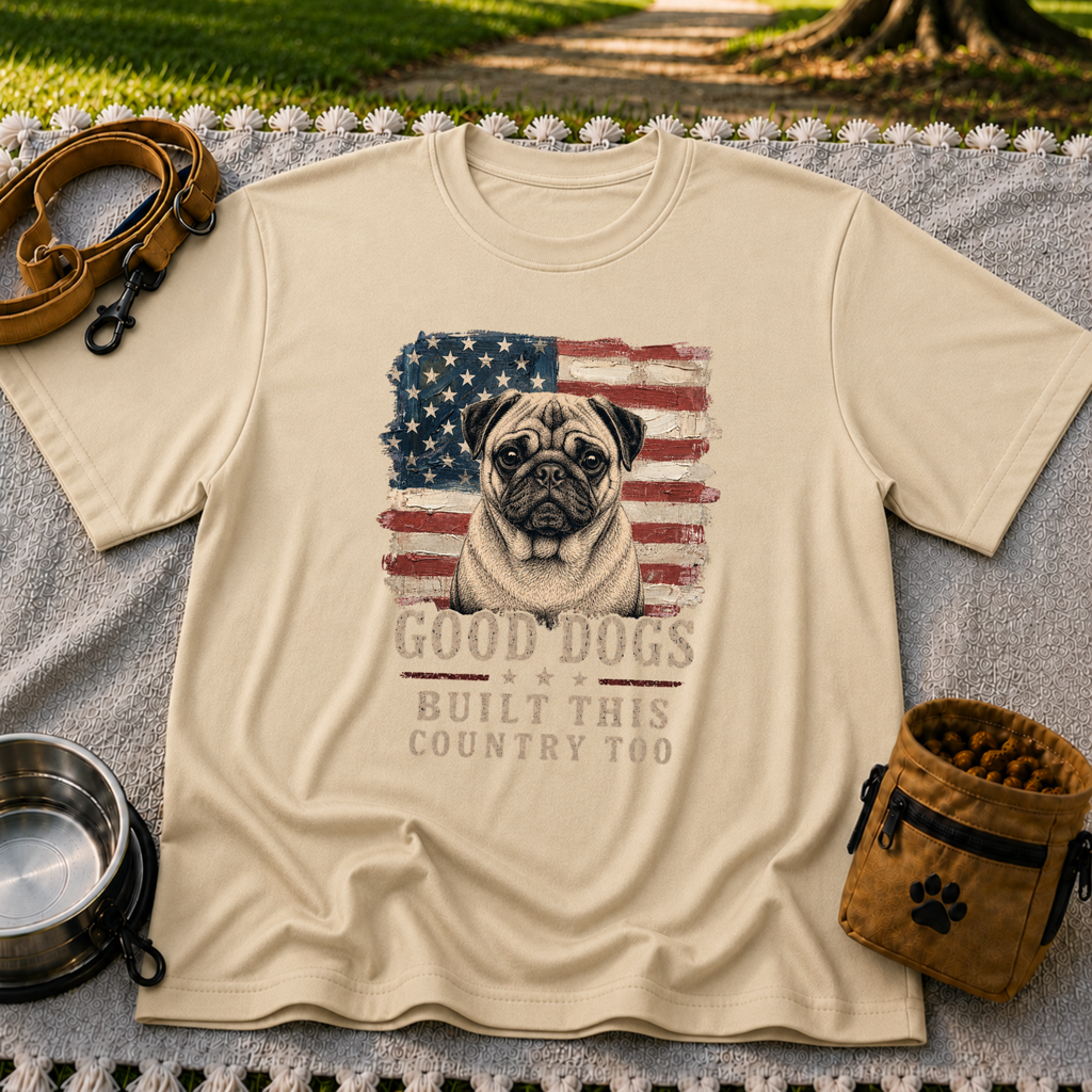 Sand T-shirt mockup featuring pug portrait against a distressed American flag with patriotic lettering.