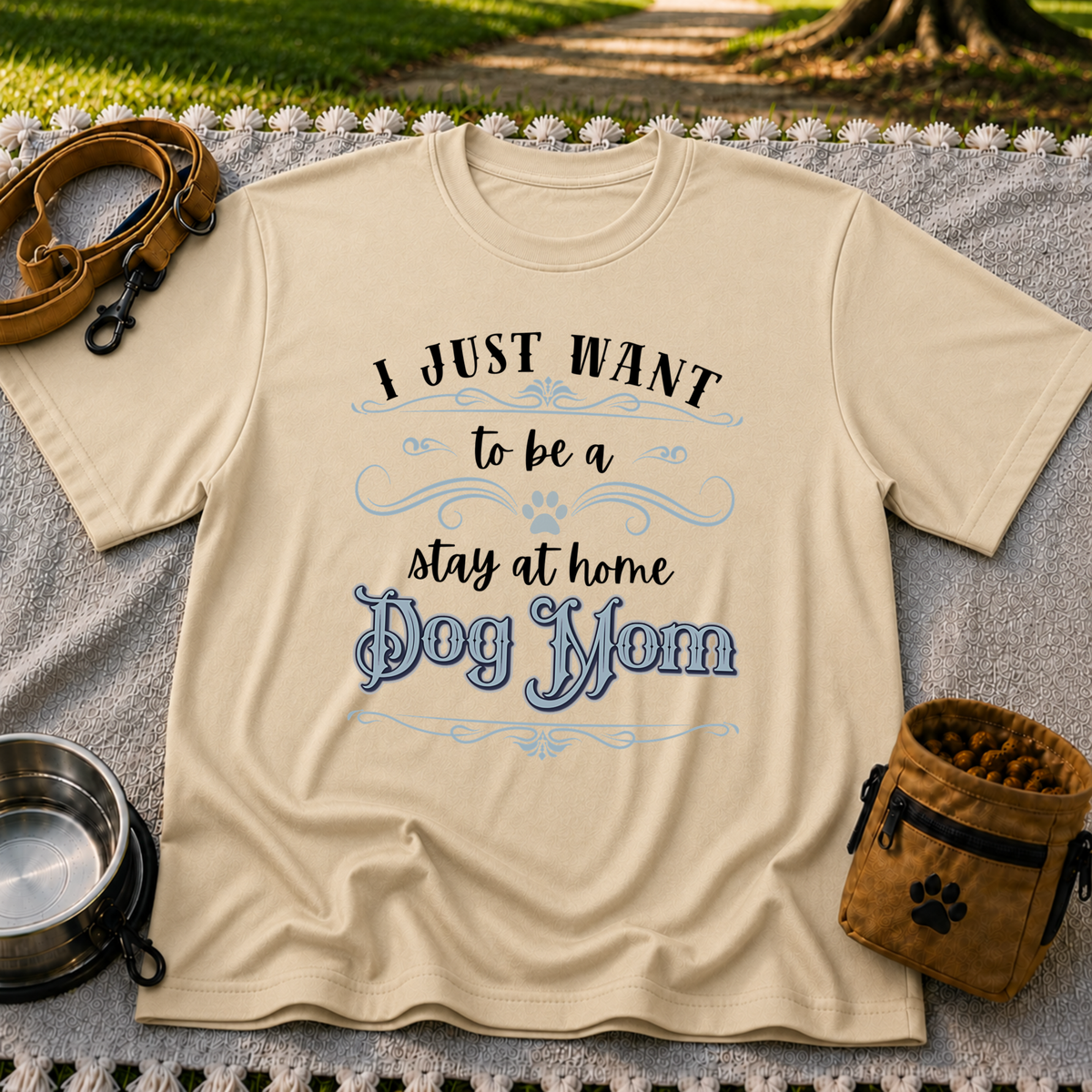 the phrase “I just want to be a stay at home dog mom”. On a Sand T-shirt.