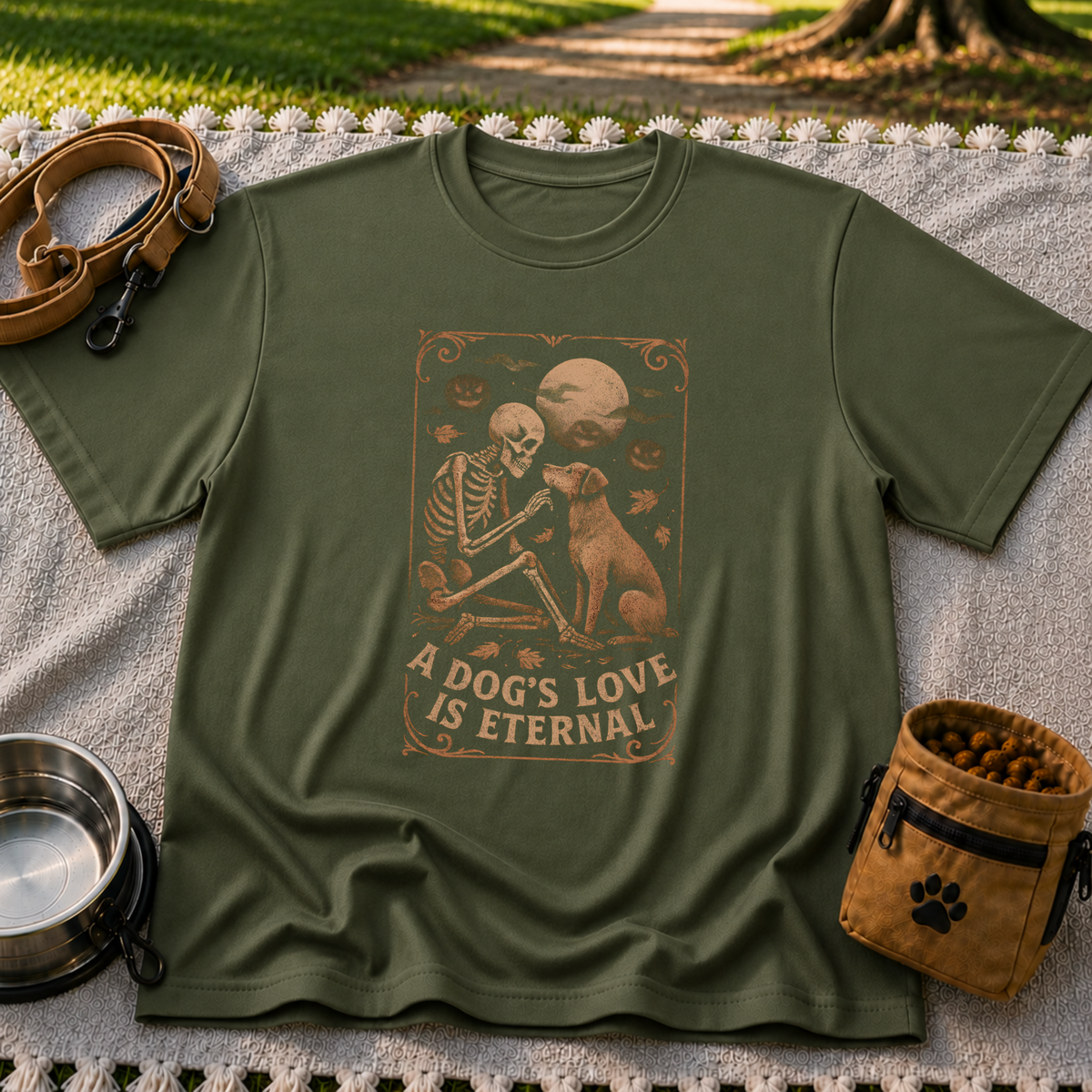 Military Green T-shirt mockup featuring a seated dog and skeleton beneath moons and planets with A Dog’s Love Is Eternal.