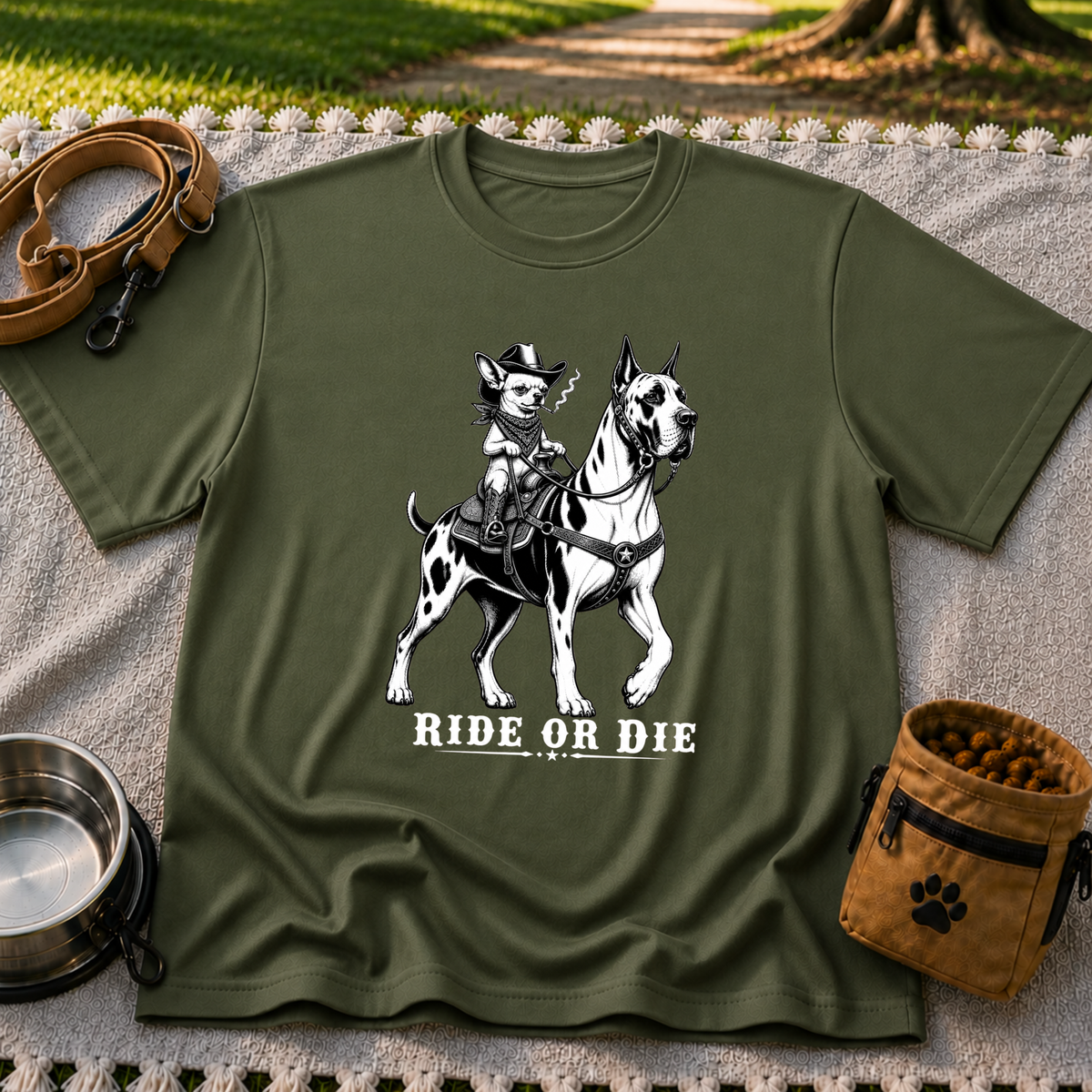 Military Green T-shirt mockup featuring cowboy-hat Chihuahua riding a Great Dane above Ride or Die lettering.
