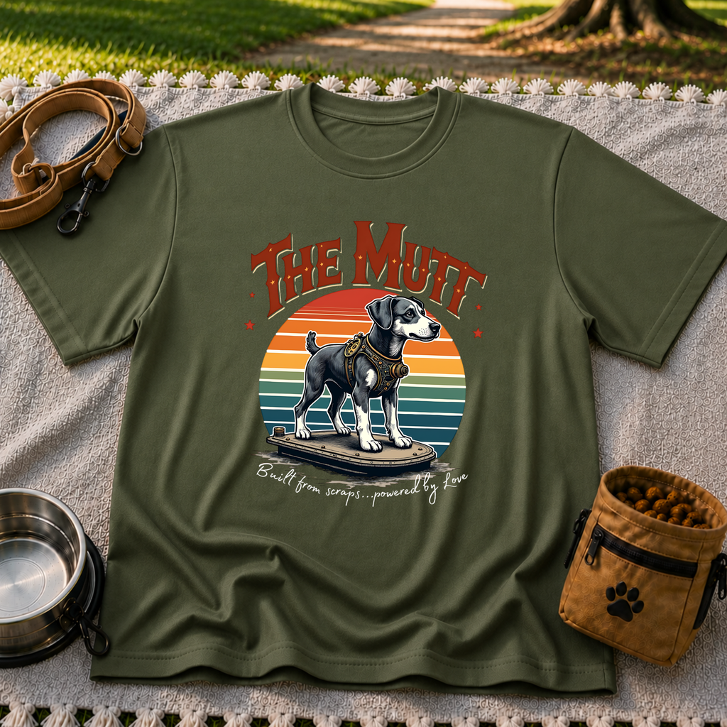 a mixed-breed dog above a “built from scraps, powered by love” sentiment. On a Military Green T-shirt.