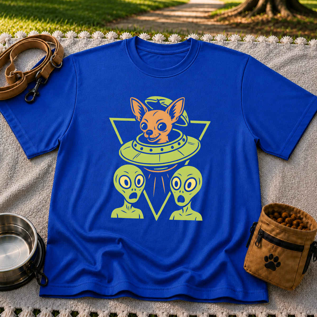 Royal T-shirt mockup featuring oversized-eared Chihuahua in a flying saucer above two small aliens.