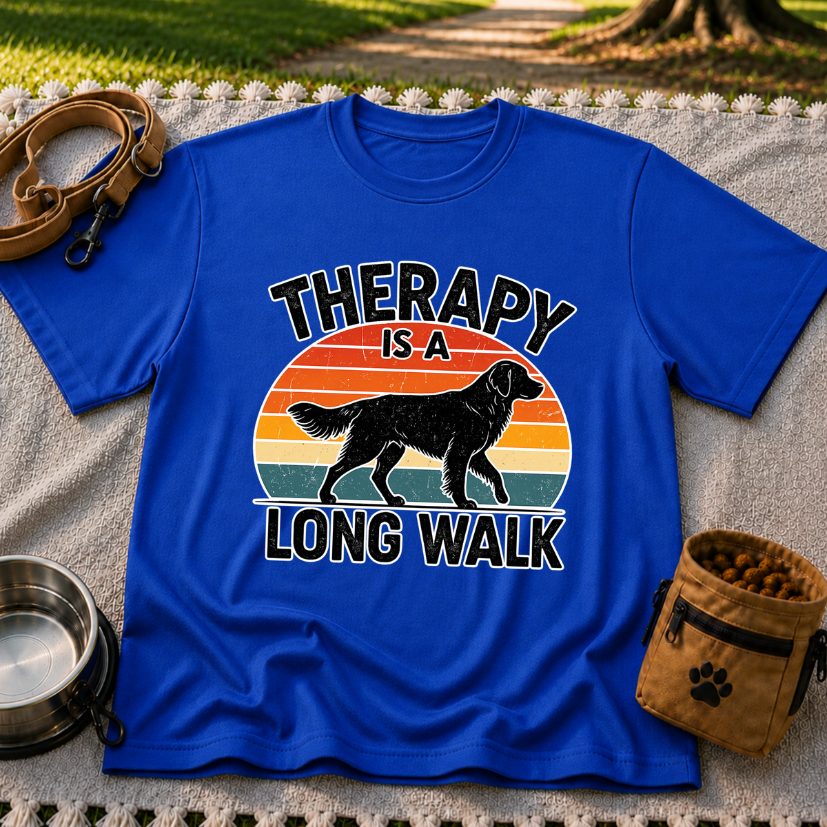 Royal T-shirt mockup featuring dog silhouette walking across a striped sunset beneath Therapy Is a Long Walk.