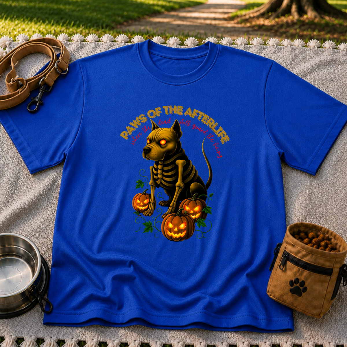 Paws of the Afterlife Pitbull Skeleton Halloween design on a Royal T-shirt.