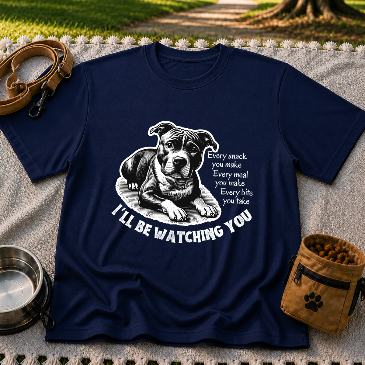 a watchful dog paired with a line about keeping an eye on you. On a Navy T-shirt.