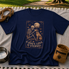 Navy T-shirt mockup featuring a seated dog and skeleton beneath moons and planets with A Dog’s Love Is Eternal.