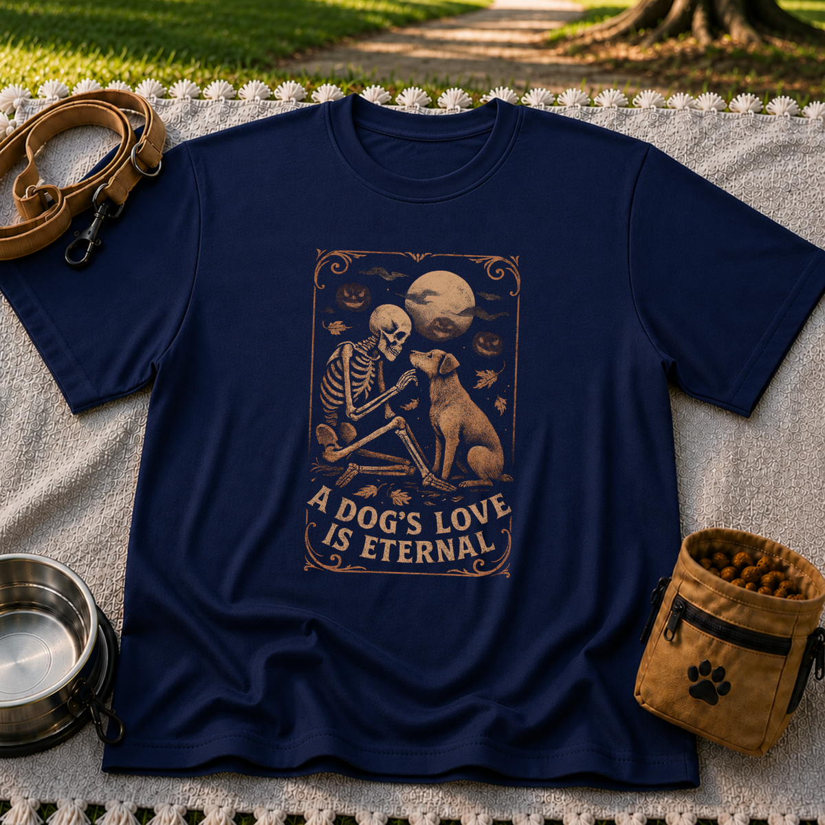 Navy T-shirt mockup featuring a seated dog and skeleton beneath moons and planets with A Dog’s Love Is Eternal.