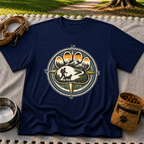 Navy T-shirt mockup featuring compass rose framing a hiker and dog on a mountain trail.