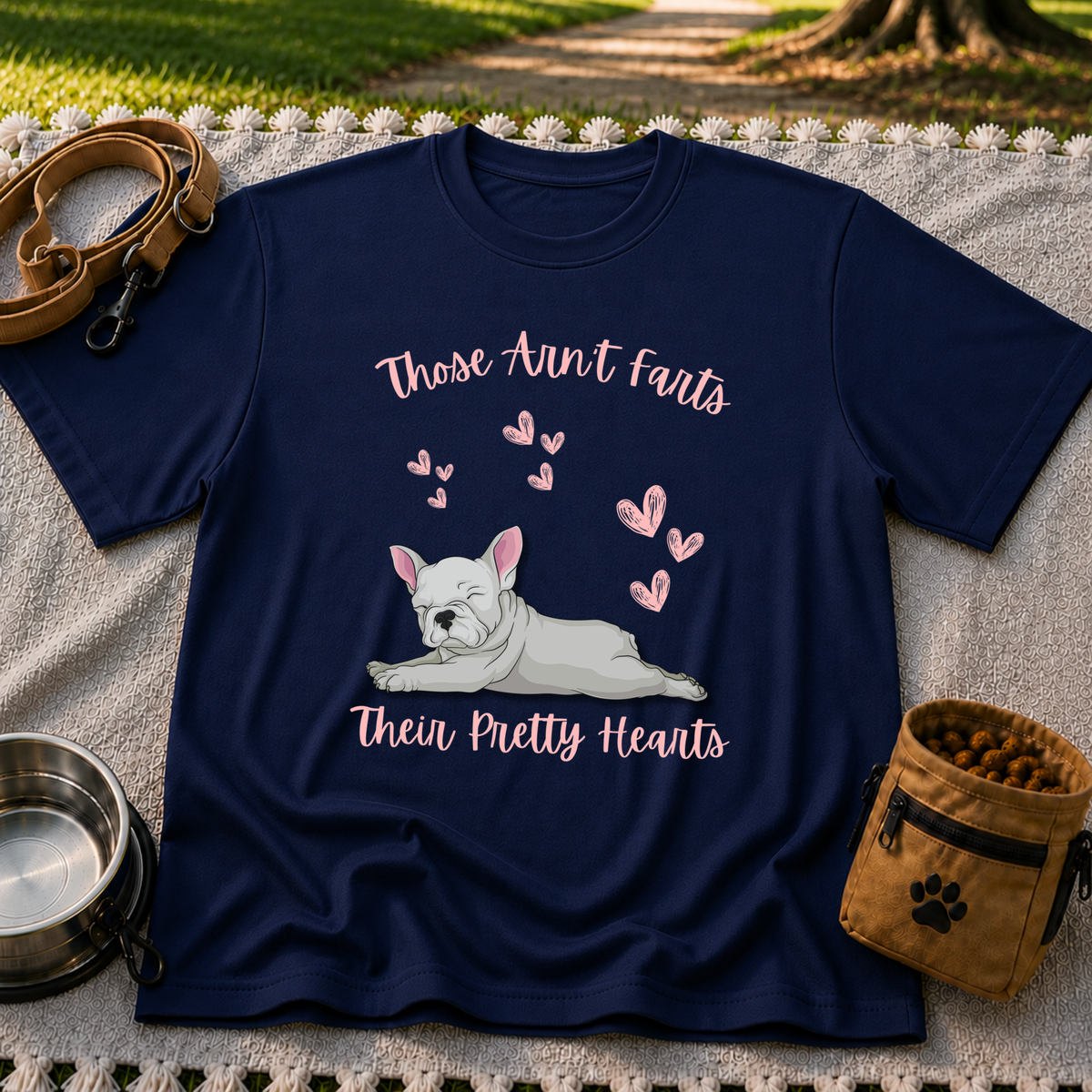 Navy T-shirt mockup featuring reclining French Bulldog surrounded by pink hearts and the Pretty Hearts joke.